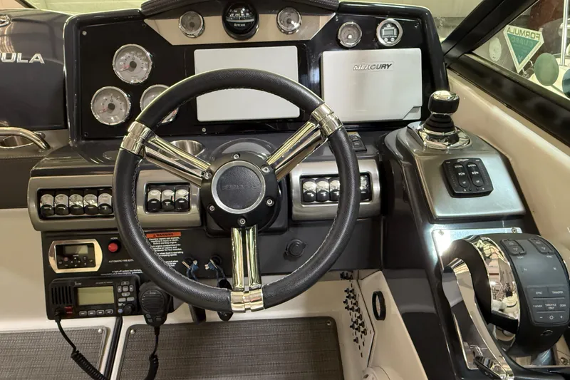 Slide: The Image of 2016 Formula 350 Crossover Bowrider dashboard with steering wheel and control panel. - 24
