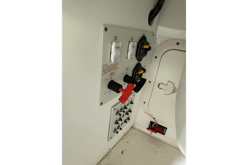 Slide: The Image of Control panel of a 2016 Formula 350 Crossover Bowrider boat, featuring switches and dials. - 27