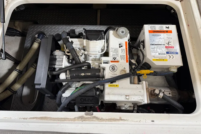 Slide: The Image of Engine compartment of a 2016 Formula 350 Crossover Bowrider, showcasing mechanical components. - 28