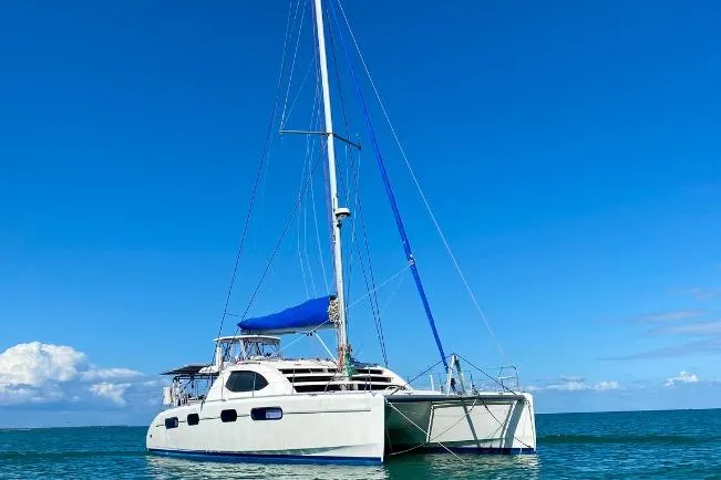 The Image of 2007 Leopard 46 catamaran sailing on calm blue waters under clear skies. - 0