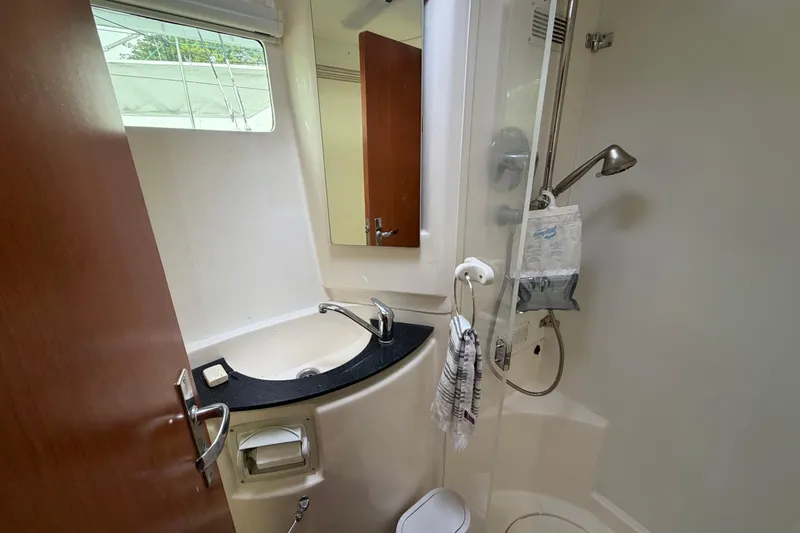 Slide: The Image of Bathroom interior of a 2007 Leopard 46 yacht, featuring a sink and shower. - 18