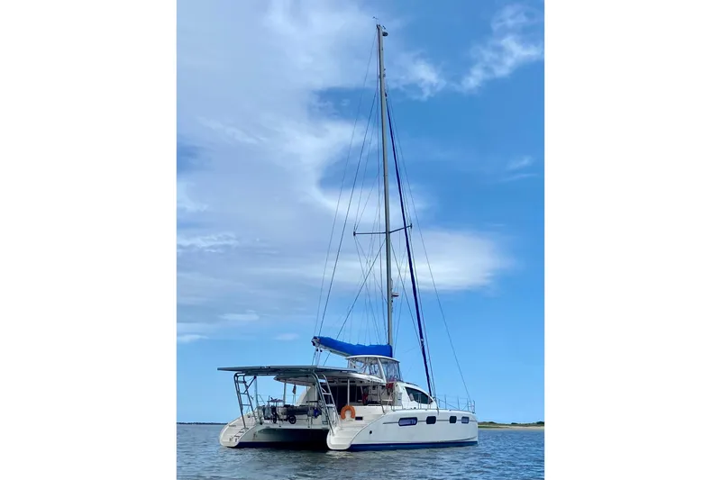 Slide: The Image of 2007 Leopard 46 catamaran sailing on calm waters under a clear blue sky. - 2