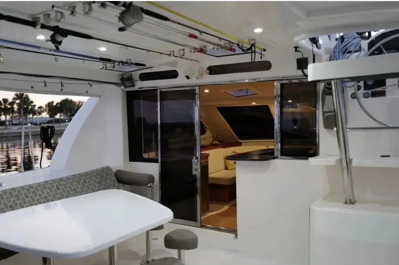 Slide: The Image of Interior view of a 2007 Leopard 46 yacht, featuring a modern dining area. - 26