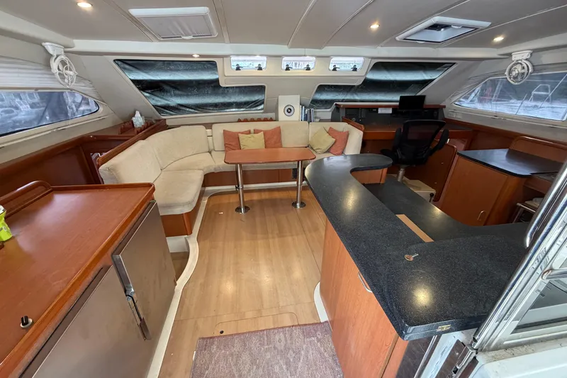 Slide: The Image of Luxurious interior of a 2007 Leopard 46 yacht with modern furnishings and spacious layout. - 3