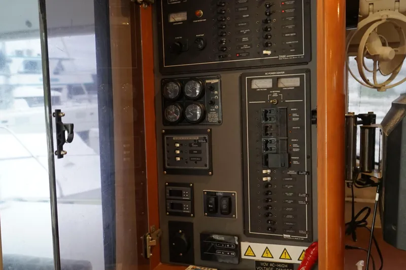 Slide: The Image of Electrical control panel on a 2007 Leopard 46 yacht, featuring gauges and switches. - 33