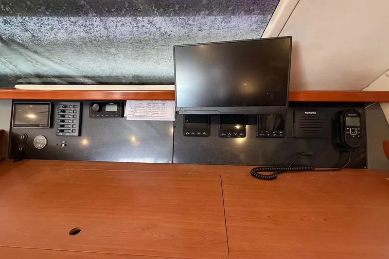 Slide: The Image of Control panel of a 2007 Leopard 46 yacht with navigation equipment and monitor. - 34