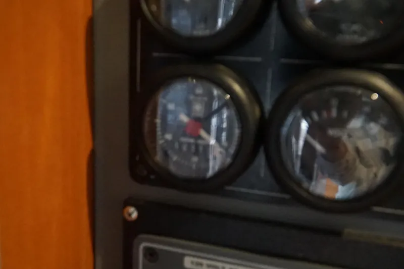 Slide: The Image of Close-up of instrument panel on 2007 Leopard 46 yacht, featuring multiple gauges. - 35
