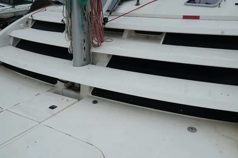 Slide: The Image of Deck view of a 2007 Leopard 46 catamaran with rigging and steps. - 39
