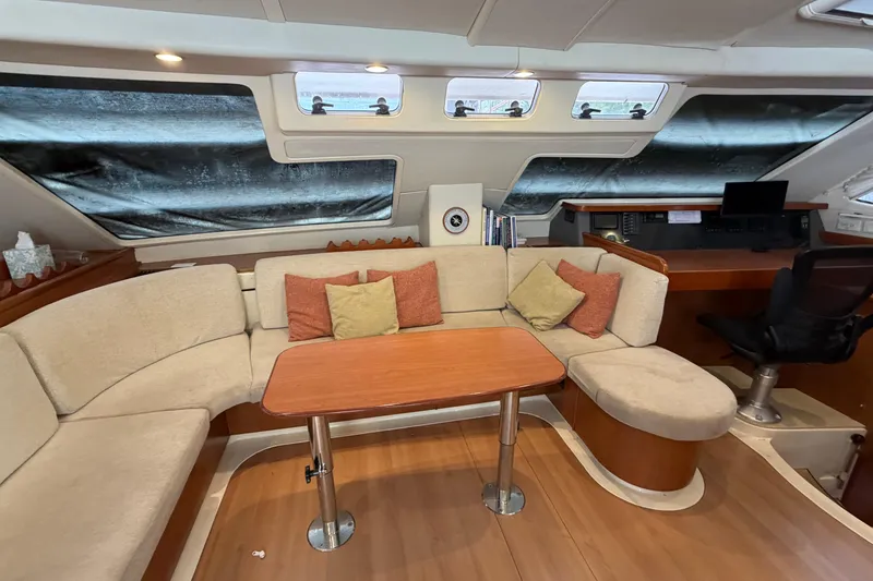 Slide: The Image of Luxurious 2007 Leopard 46 yacht interior with cozy seating and navigation area. - 4