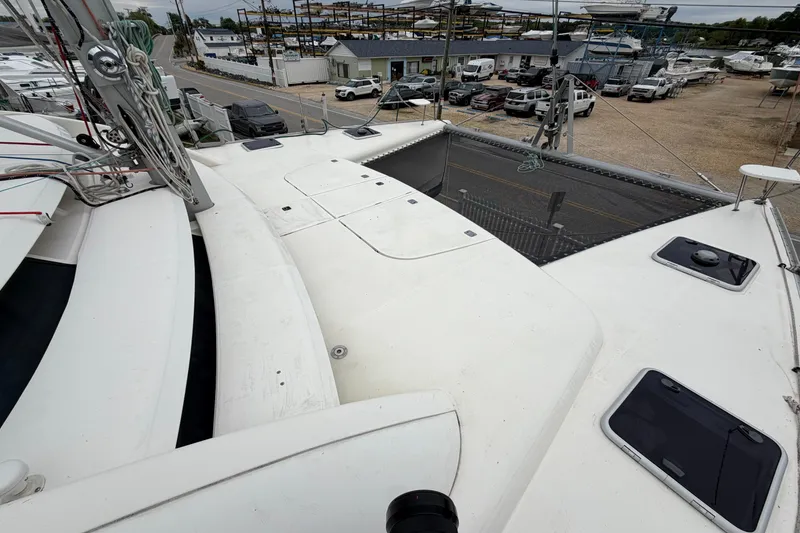 Slide: The Image of Deck view of a 2007 Leopard 46 catamaran in a marina setting. - 40