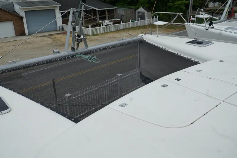 Slide: The Image of Leopard 46 catamaran deck with netting, 2007 model, docked near garages. - 41