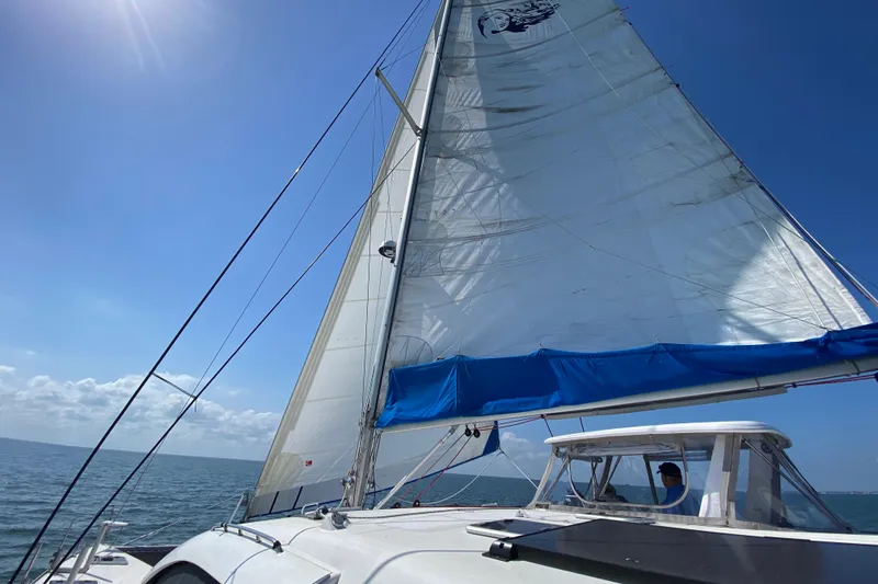 Slide: The Image of Sailing on a 2007 Leopard 46 catamaran under clear blue skies. - 44