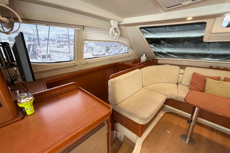 Slide: The Image of Luxurious interior of a 2007 Leopard 46 yacht with cozy seating and modern amenities. - 5