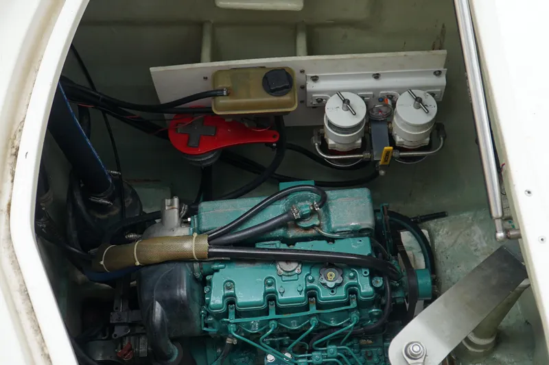 Slide: The Image of Engine compartment of a 2007 Leopard 46 yacht, featuring a well-maintained marine engine. - 51
