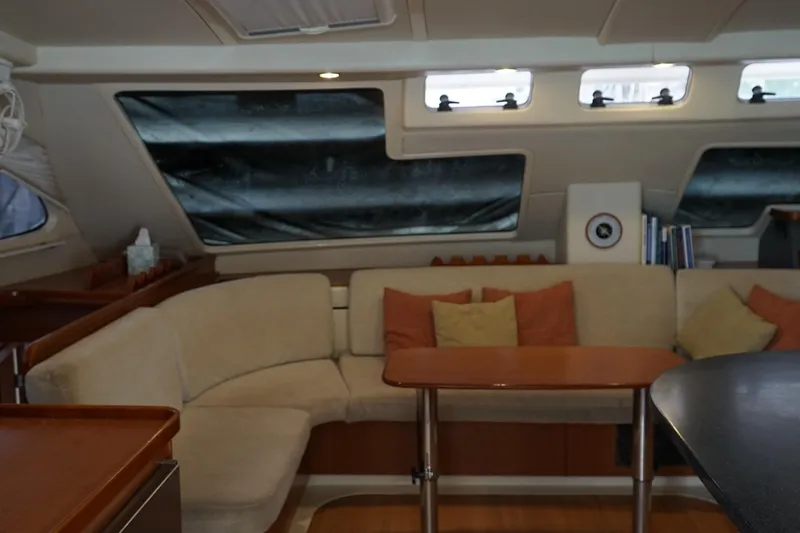 Slide: The Image of Luxurious interior of a 2007 Leopard 46 yacht with cozy seating and elegant design. - 9