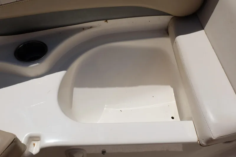 Slide: The Image of 2006 Glastron GXL 205 boat interior with cup holder and seating area. - 10