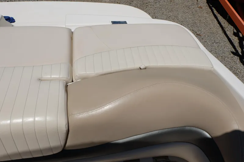 Slide: The Image of 2006 Glastron GXL 205 boat seat with beige and white upholstery. - 19