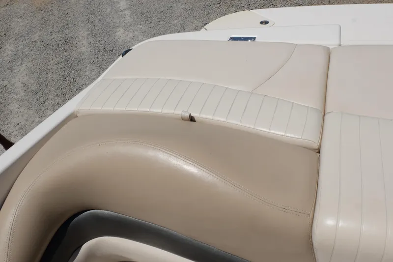 Slide: The Image of 2006 Glastron GXL 205 boat interior with beige leather seating. - 22