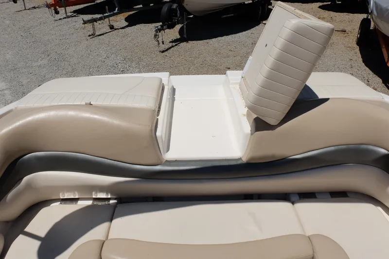 Slide: The Image of 2006 Glastron GXL 205 boat interior with beige seating and backrest. - 23
