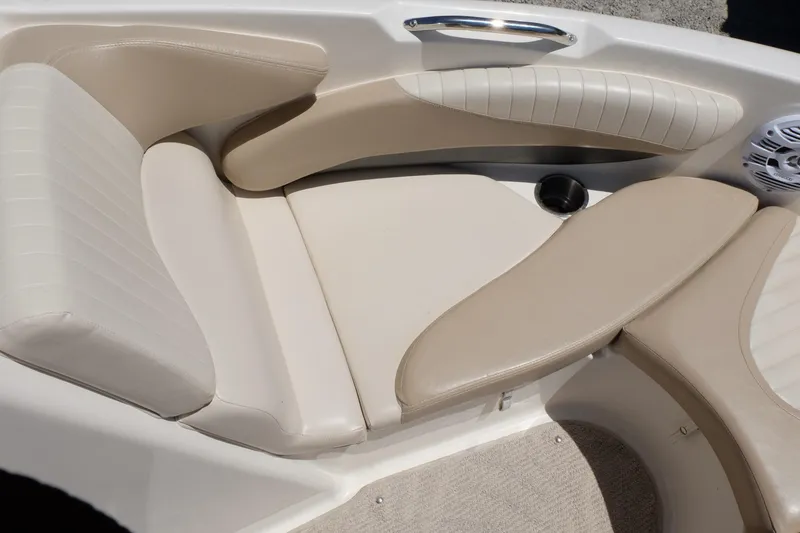 Slide: The Image of 2006 Glastron GXL 205 boat interior with beige seating and cup holder. - 5