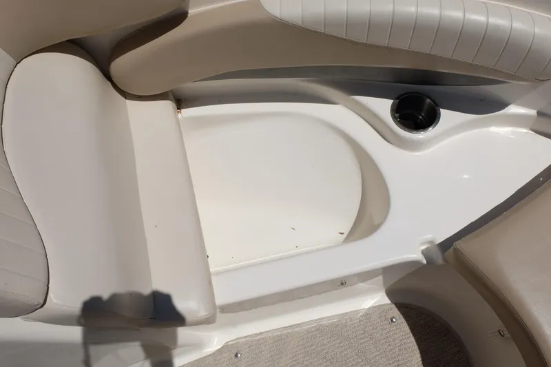 Slide: The Image of Interior seating of 2006 Glastron GXL 205 boat with cup holder. - 6