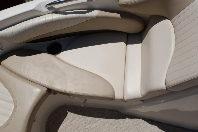 Slide: The Image of 2006 Glastron GXL 205 boat interior with beige and white seating. - 8