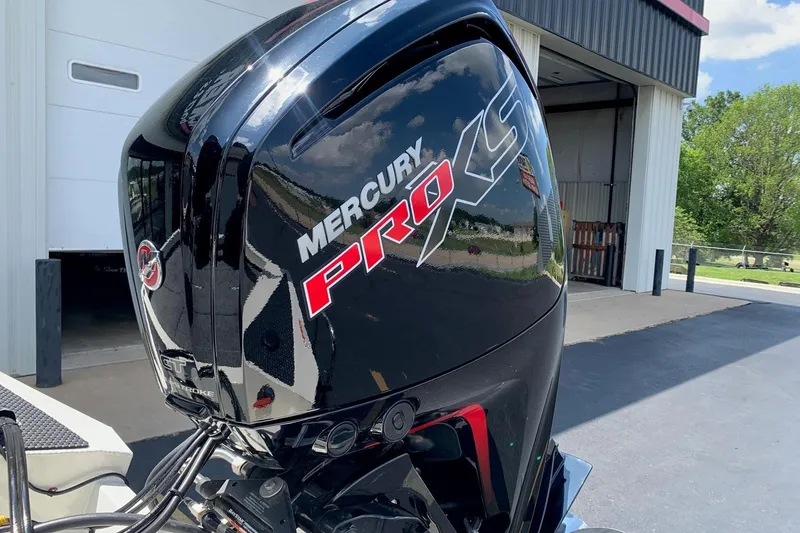 Slide: The Image of 2026 Ranger RT188P with Mercury Pro XS outboard motor in a sunny outdoor setting. - 4
