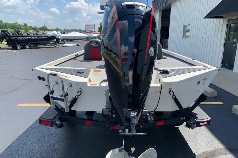 Slide: The Image of 2026 Ranger RT188P boat with powerful outboard motor, parked outdoors on a sunny day. - 3