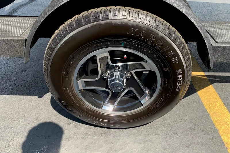 Slide: The Image of 2026 Ranger RT188P trailer tire with Karrier KR35 branding on asphalt surface. - 9