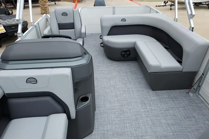 Slide: The Image of 2026 Sun Tracker Party Barge 18 DLX interior with gray seating and modern design. - 3