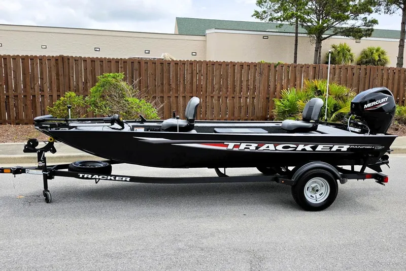 Slide: The Image of 2026 Tracker Panfish 17 boat on trailer, featuring Mercury outboard motor. - 6