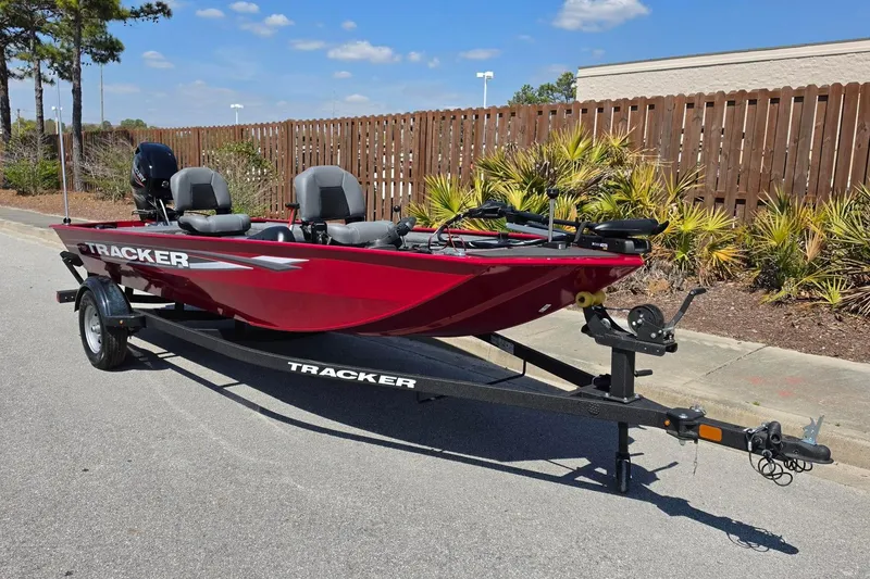Slide: The Image of 2026 Tracker Panfish 17 boat on trailer, parked outdoors, sunny day. - 5