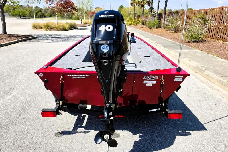 Slide: The Image of 2026 Tracker Panfish 17 boat with Mercury 40 engine, parked outdoors. - 8