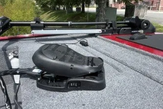 Slide: The Image of 2026 Tracker Panfish 17 boat deck with mounted equipment and gray carpeting. - 5