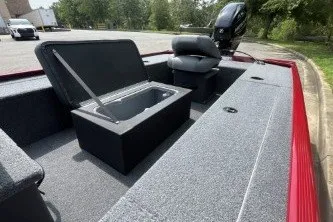 Slide: The Image of 2026 Tracker Panfish 17 boat interior with open storage compartment and seating. - 8