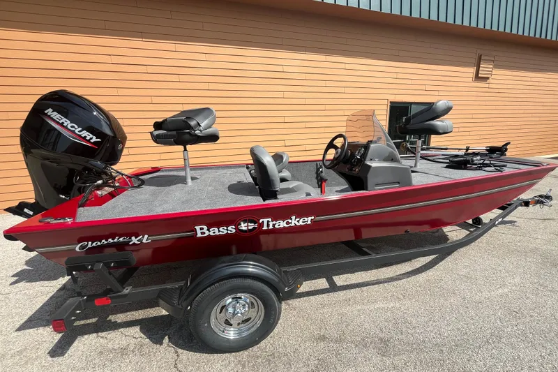 The Image of 2026 Tracker Bass Tracker Classic XL boat with Mercury engine, parked outdoors. - 0