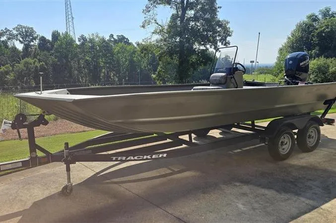 Slide: The Image of 2026 Tracker Grizzly 2072 CC boat on trailer, parked outdoors. - 3