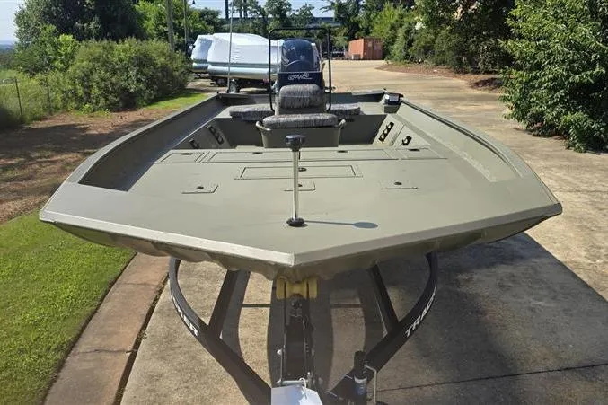 Slide: The Image of 2026 Tracker Grizzly 2072 CC boat on trailer, parked outdoors. - 4