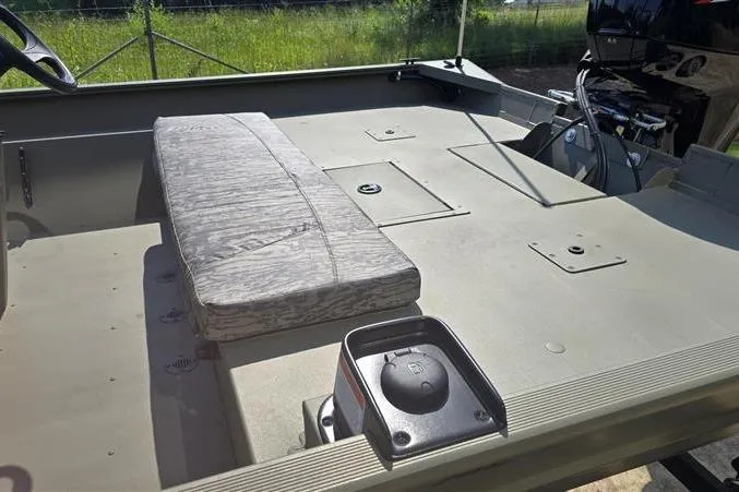 Slide: The Image of 2026 Tracker Grizzly 2072 CC boat interior with seating and storage compartments. - 6