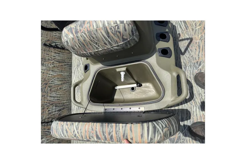 Slide: The Image of Interior view of 2026 Tracker Grizzly 2072 CC boat with open storage compartment. - 10