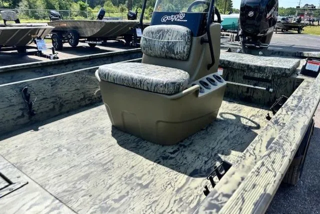 Slide: The Image of 2026 Tracker Grizzly 1860 CC boat with camo seating and spacious deck. - 16