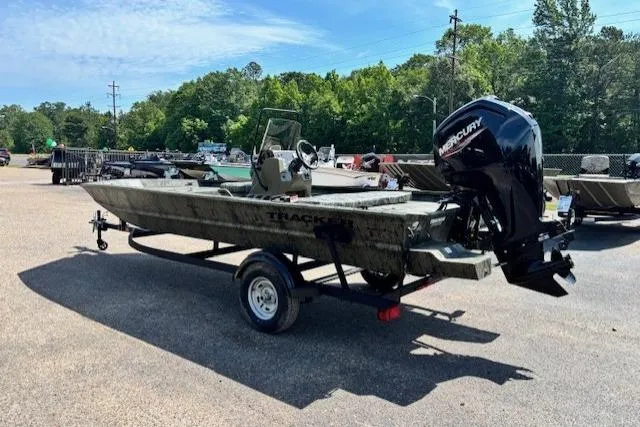 Slide: The Image of 2026 Tracker Grizzly 1860 CC boat with Mercury outboard motor on trailer. - 3