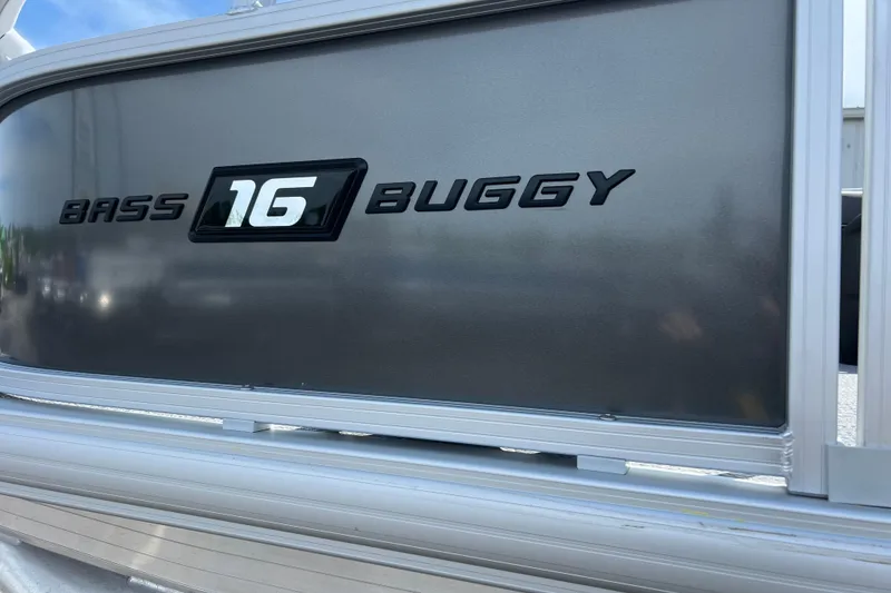Slide: The Image of 2026 Sun Tracker Bass Buggy 16 XL Select logo on metallic surface. - 2