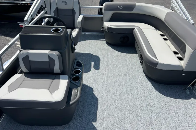 Slide: The Image of Interior of 2026 Sun Tracker Bass Buggy 16 XL Select pontoon boat with seating and steering console. - 3