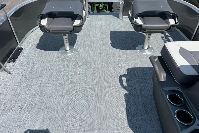 Slide: The Image of 2026 Sun Tracker Bass Buggy 16 XL Select interior with seating and carpeted deck. - 5