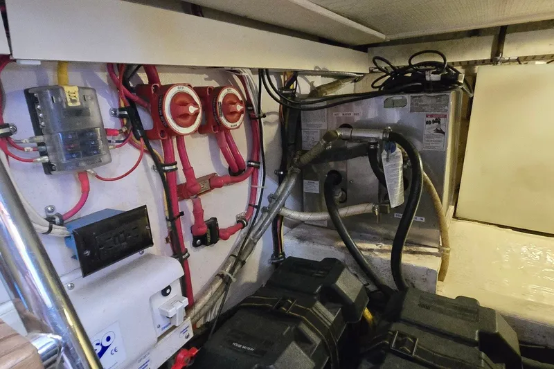 Slide: The Image of Electrical and plumbing systems inside a 2004 Sabre 36 boat. - 64