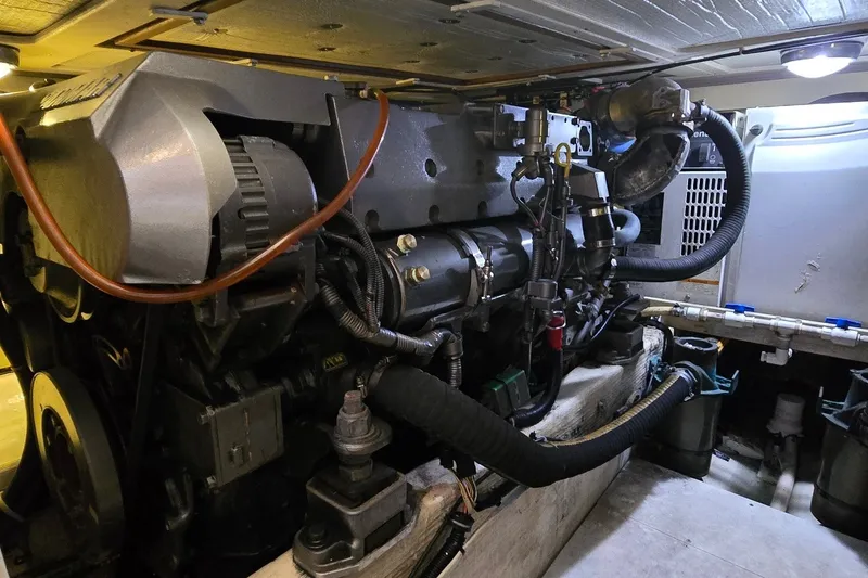 Slide: The Image of Engine compartment of a 2004 Sabre 36 boat, showcasing mechanical components and wiring. - 59