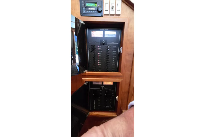 Slide: The Image of Electrical panel inside a 2004 Sabre 36 boat, featuring switches and controls. - 50