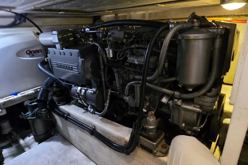 Slide: The Image of Engine room of a 2004 Sabre 36 yacht featuring a Yanmar engine. - 56