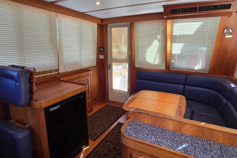 Slide: The Image of Interior of 2004 Sabre 36 yacht with wood finish and blue seating. - 28